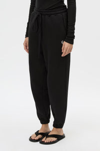 Cropped view CAMILLA AND MARC Lyra Logo Track Pant in Black and White with relaxed fit and embroidered initial detail.