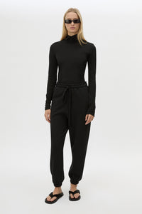 Front view CAMILLA AND MARC Lyra Logo Track Pant in Black and White with relaxed fit and embroidered initial detail.