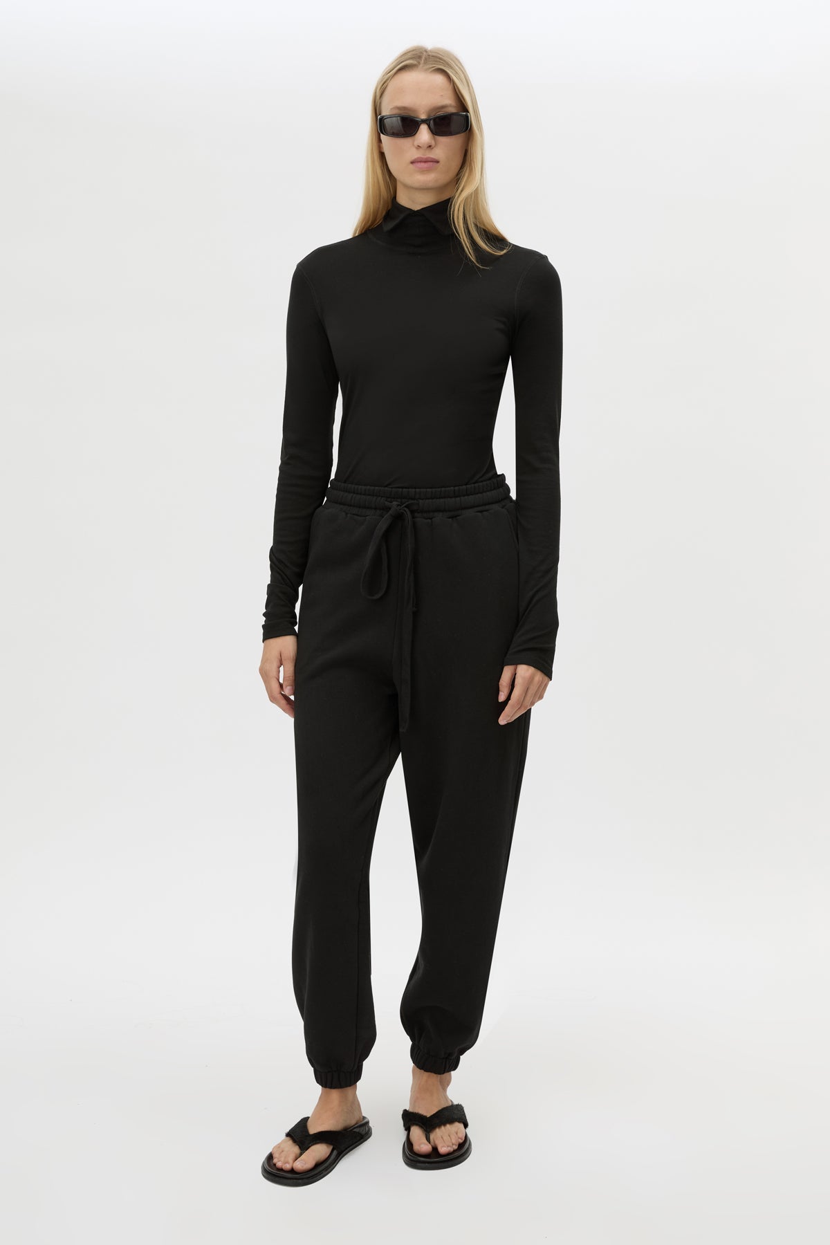 Front view CAMILLA AND MARC Lyra Logo Track Pant in Black and White with relaxed fit and embroidered initial detail.