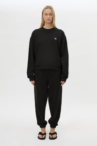 Front view CAMILLA AND MARC Lyra Logo Track Pant in Black and White styled with Lyra Tracksuit Top.