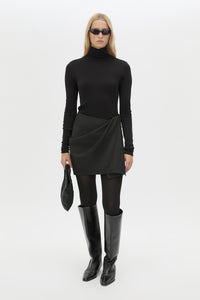 Front view CAMILLA AND MARC Mackinley Mini Wrap Skirt in Black with a draped low‑rise silhouette.