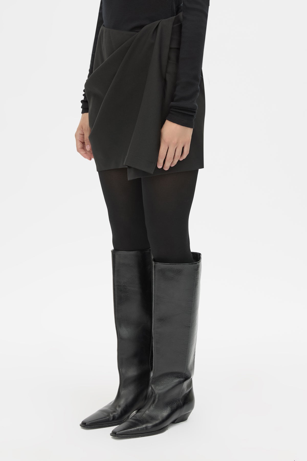 Cropped view CAMILLA AND MARC Mackinley Mini Wrap Skirt in Black with a draped low‑rise silhouette.