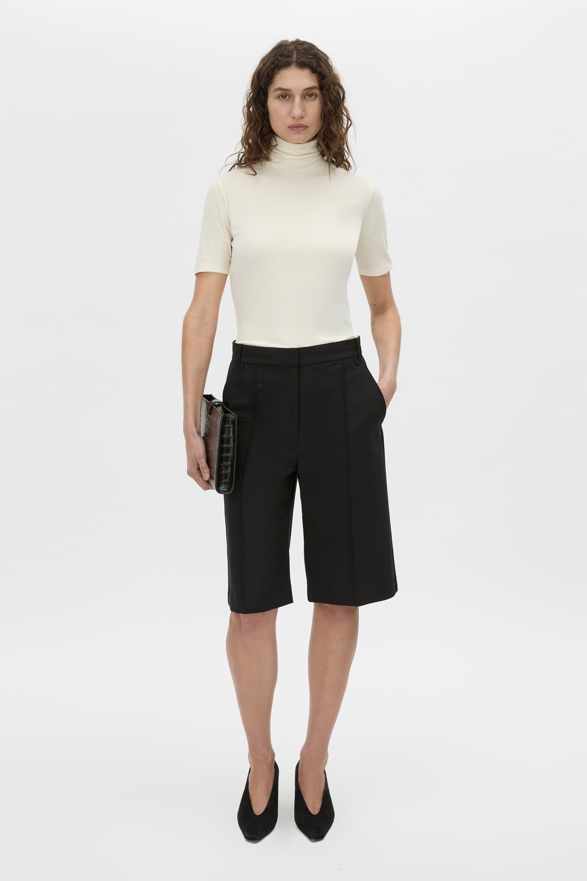 Front view CAMILLA AND MARC Mackinley black mid-rise bermuda shorts are crafted from a lightweight yet structured fabrication.