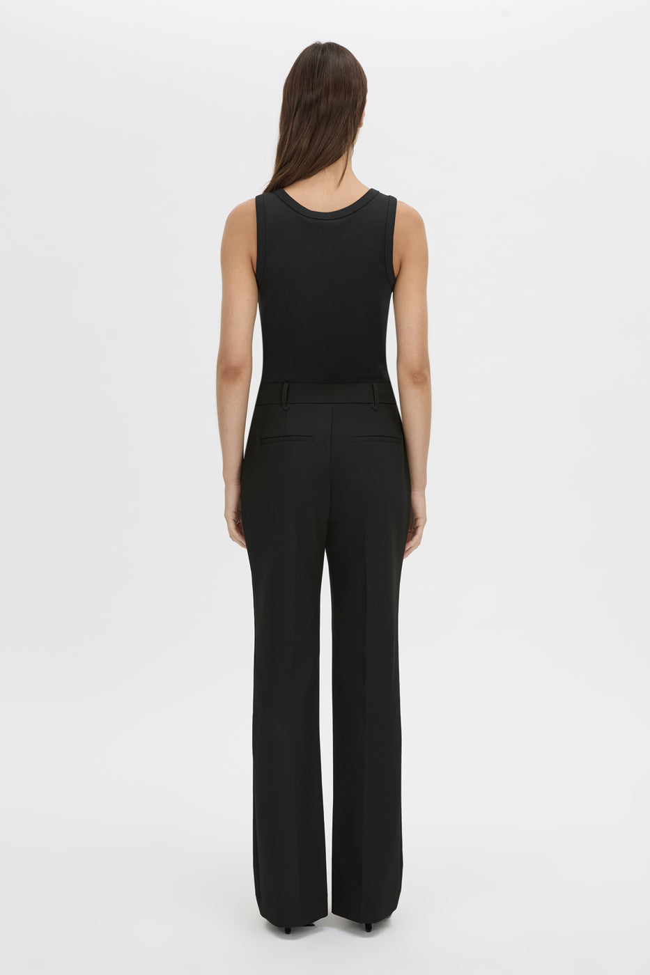 Back view CAMILLA AND MARC Mackinley high-wasited slim leg pant in black with pintuck details.