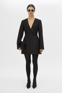 Front styled view CAMILLA AND MARC Mackinley Mini Dress in Black with long sleeves and plunge V‑neckline.