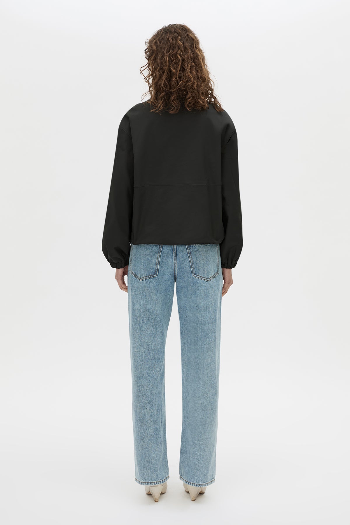 Back view CAMILLA AND MARC Mahdavi funnel neck jacket in black.