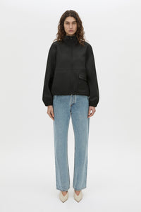 Front-styled-2 view CAMILLA AND MARC Mahdavi funnel neck jacket in black.