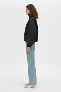Side view CAMILLA AND MARC Mahdavi funnel neck jacket in black.