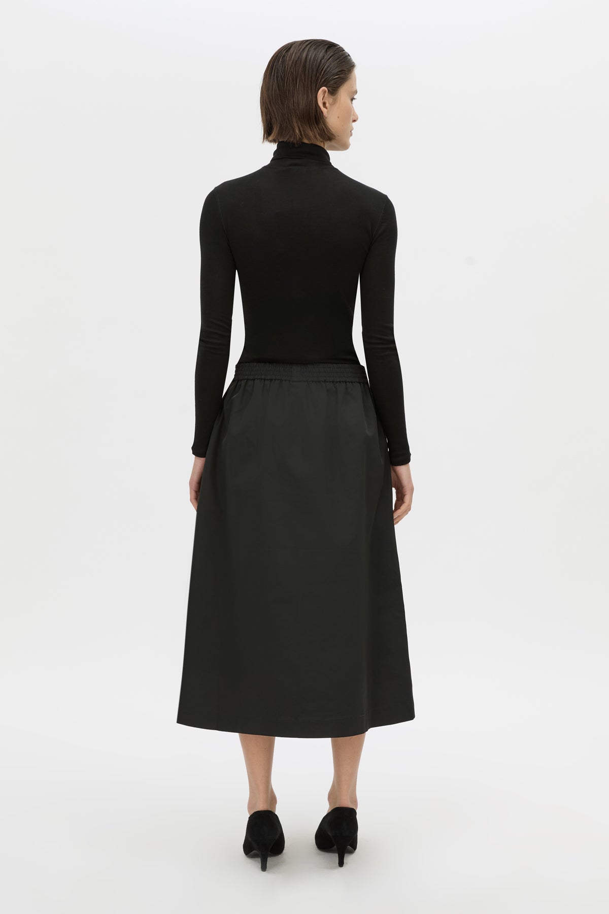 Back view CAMILLA AND MARC Mahdavi midi skirt in black.