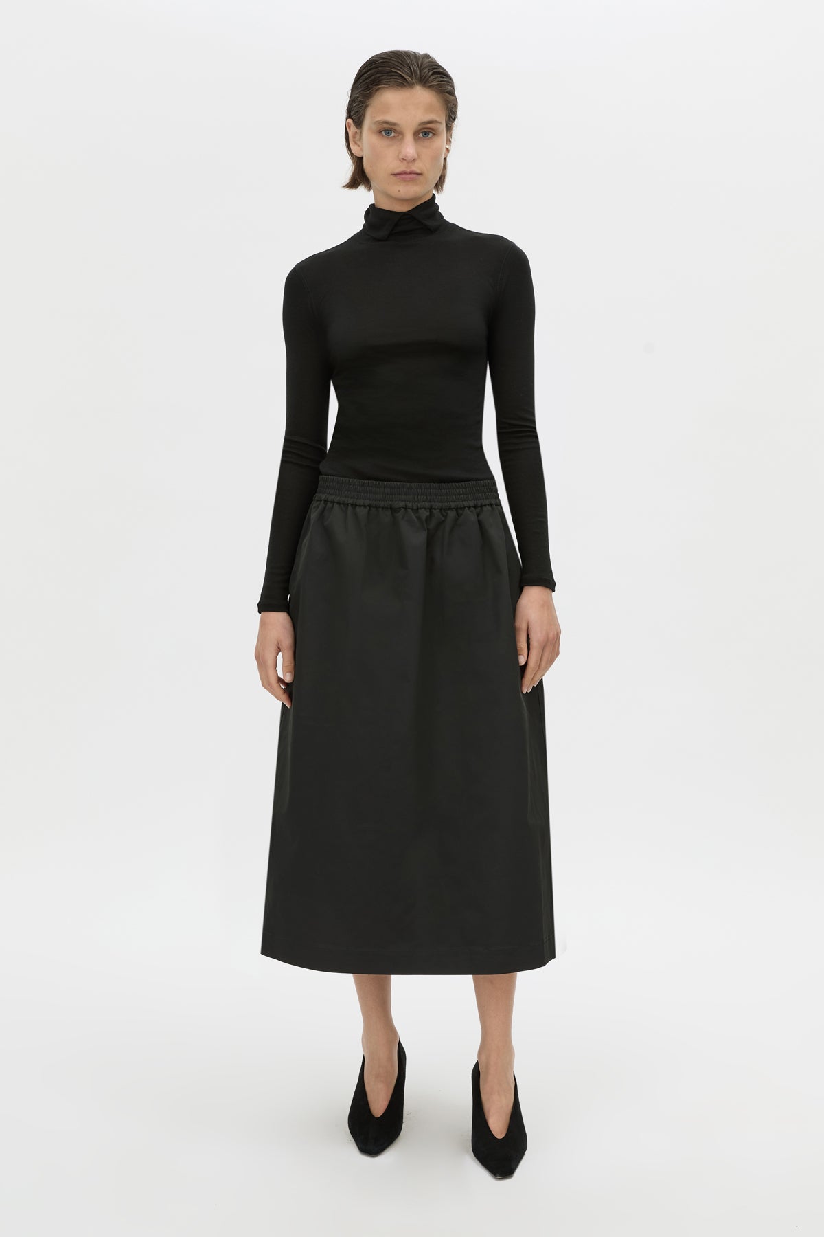Front-styled view CAMILLA AND MARC Mahdavi midi skirt in black.