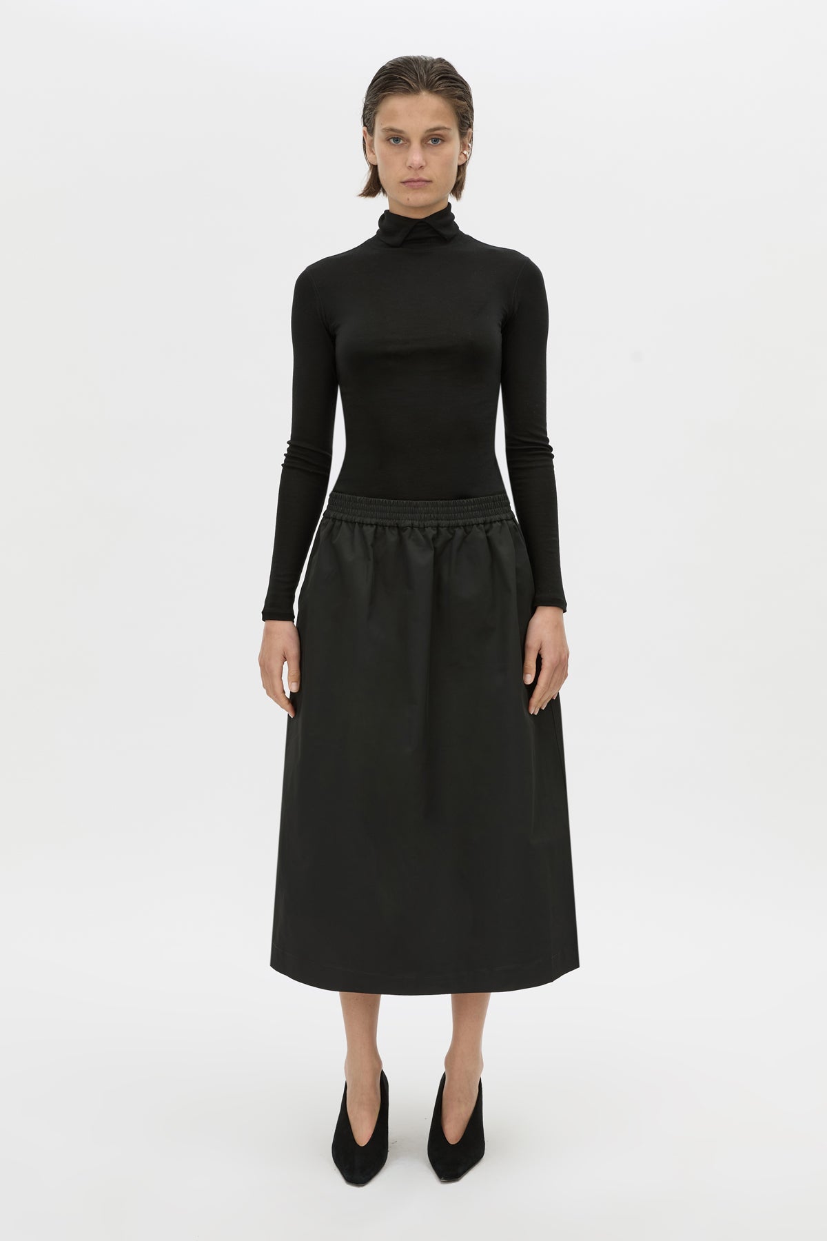Front view CAMILLA AND MARC Mahdavi midi skirt in black.