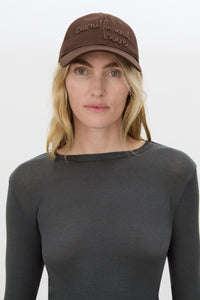 Front view CAMILLA AND MARC Maren Embroidered Cap in Chocolate Brown with front embroidered artwork.