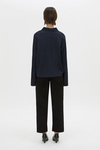 Back view CAMILLA AND MARC cotton Moreno Long Sleeve Polo Top in navy with quarter external button placket.