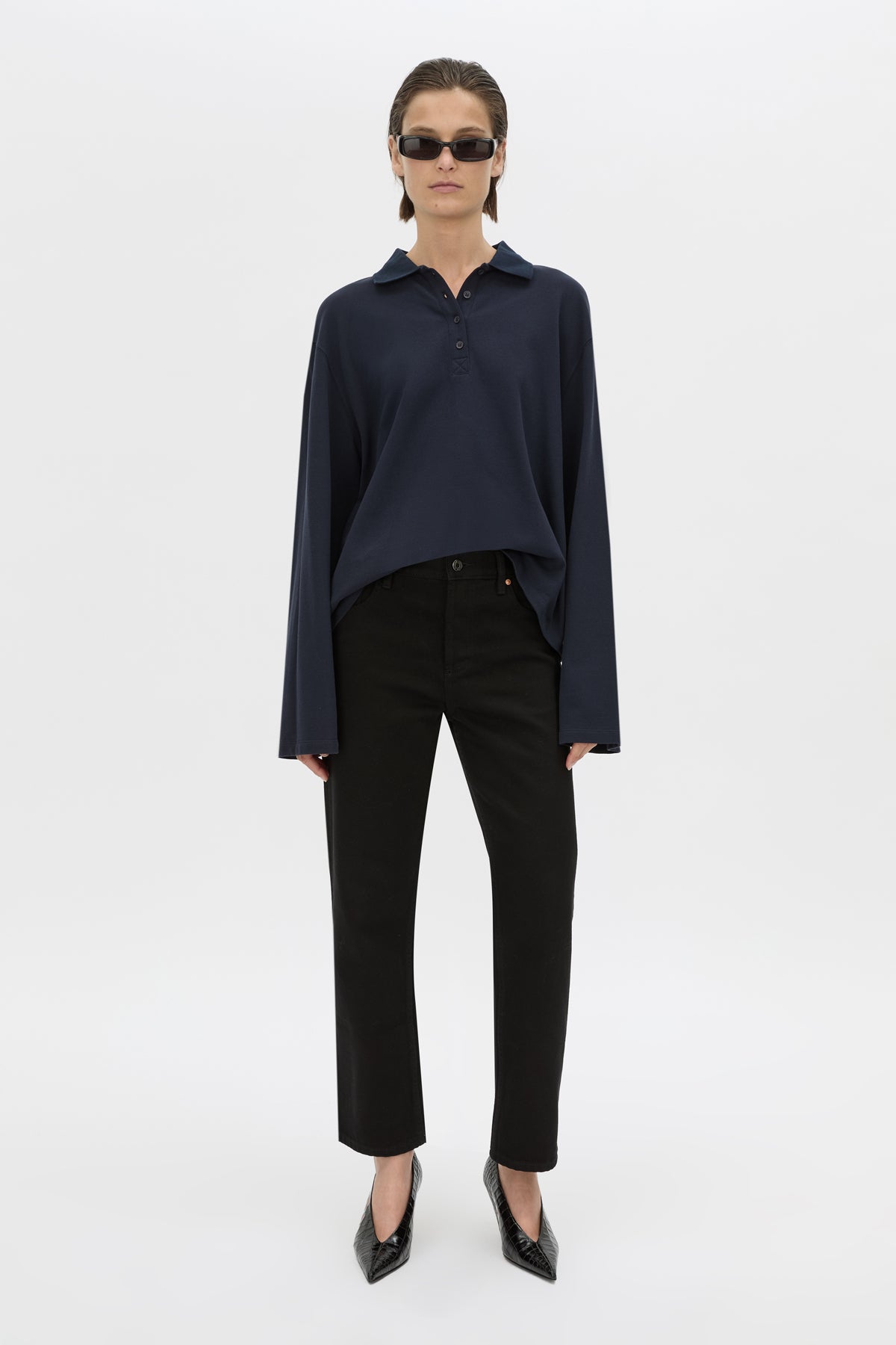 Front-styled view CAMILLA AND MARC cotton Moreno Long Sleeve Polo Top in navy with quarter external button placket.