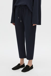 Cropped view CAMILLA AND MARC Moreno Pique Track Pant in navy with elastic‑encased waistband and embroidered eyelets and drawcord.
