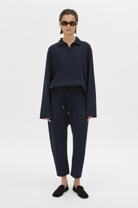 Front view CAMILLA AND MARC Moreno Pique Track Pant in navy with elastic‑encased waistband and embroidered eyelets and drawcord.