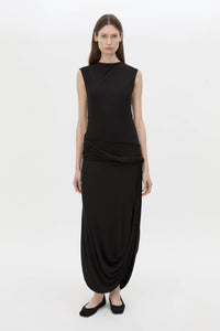 Front-styled view CAMILLA AND MARC Myro Midi Dress in black with a fitted waistline and a twisted drape detail at the hip.