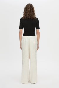 Back view CAMILLA AND MARC mid-rise Naidee Satin Relaxed Pant in ivory white with an elasticated gathered waistband.
