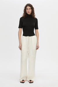 Front view CAMILLA AND MARC mid-rise Naidee Satin Relaxed Pant in ivory white with an elasticated gathered waistband.