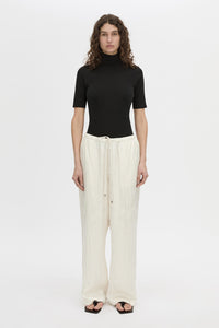 Front view CAMILLA AND MARC mid-rise Naidee Satin Relaxed Pant in ivory white with an elasticated gathered waistband.