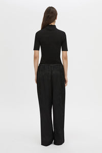 Back view CAMILLA AND MARC mid-rise Naidee Satin Relaxed Pant in black with an elasticated gathered waistband.