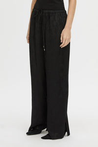 Cropped view CAMILLA AND MARC mid-rise Naidee Satin Relaxed Pant in black with an elasticated gathered waistband.