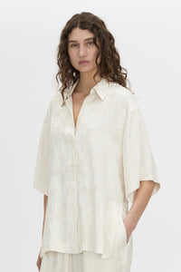 Cropped view CAMILLA AND MARC Naidee Satin Short Sleeve Shirt in ivory white.