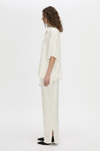 Side view CAMILLA AND MARC Naidee Satin Short Sleeve Shirt in ivory white.