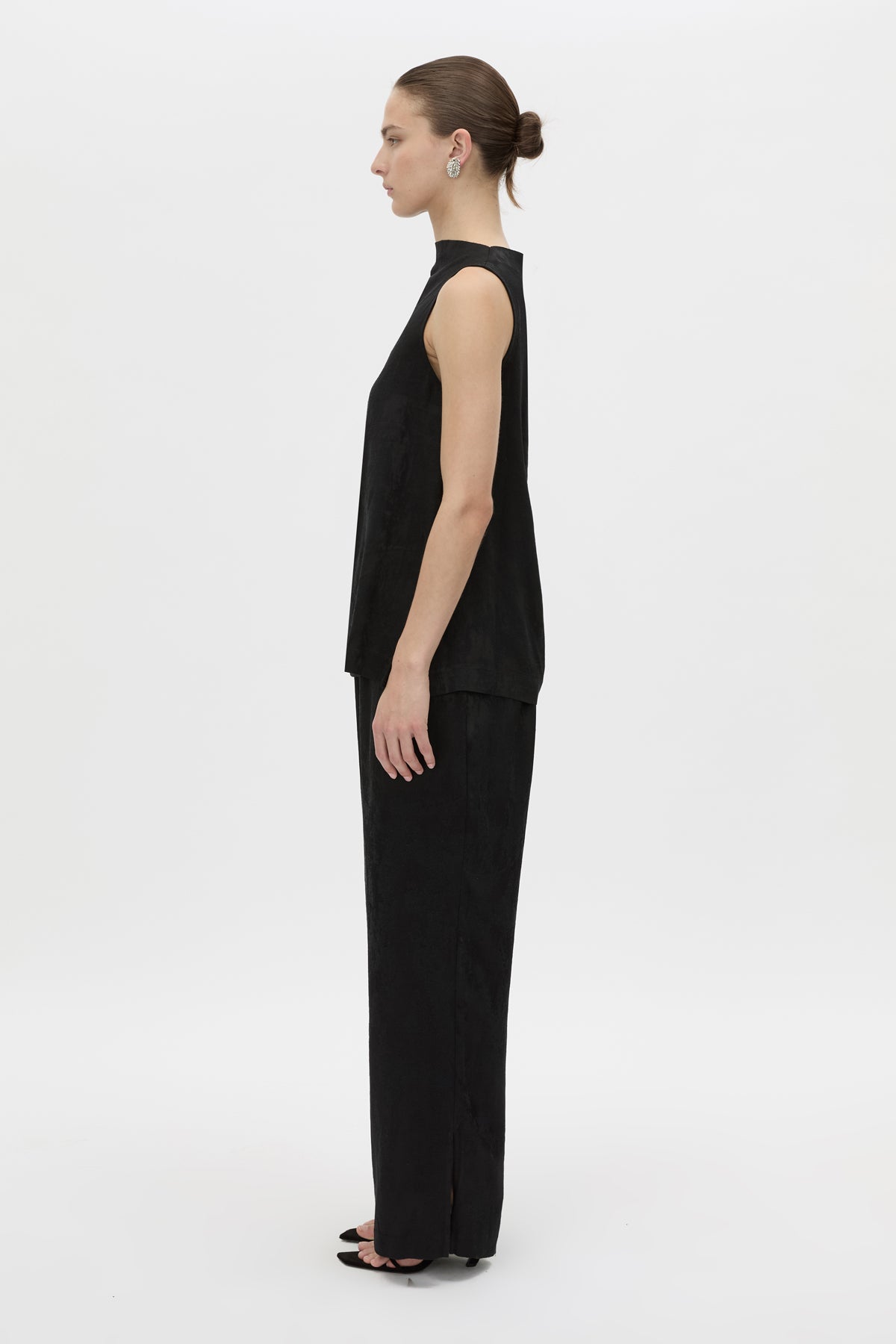 Side view CAMILLA AND MARC Naidee Satin Sleeveless Top in black with sleeveless shell design in satin fabrication.