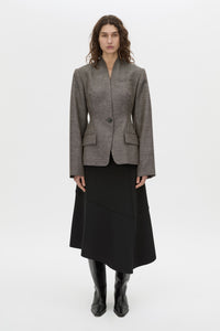 Front-styled-2 view CAMILLA AND MARC high-waisted Namira Midi Skirt in black with asymmetric hemline.