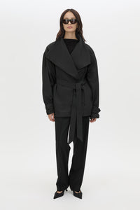 Front view CAMILLA AND MARC Nasir Cropped Jacket in Black with high‑neck, double‑breasted wrap design.