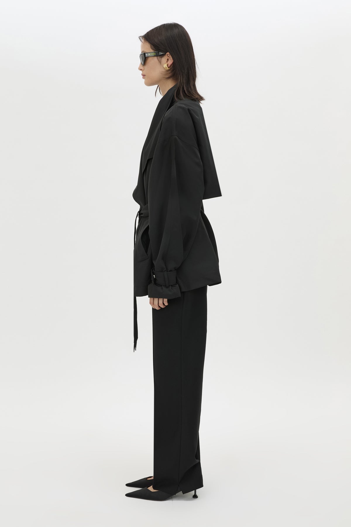 Side view CAMILLA AND MARC Nasir Cropped Jacket in Black with high‑neck, double‑breasted wrap design.