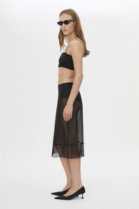 Side view CAMILLA AND MARC Noe Skirt in Black with a sheer high‑waisted pencil midi silhouette.