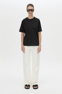 Front view CAMILLA AND MARC relaxed Olympia Print Tee in black with white plastisol artwork at centre back.