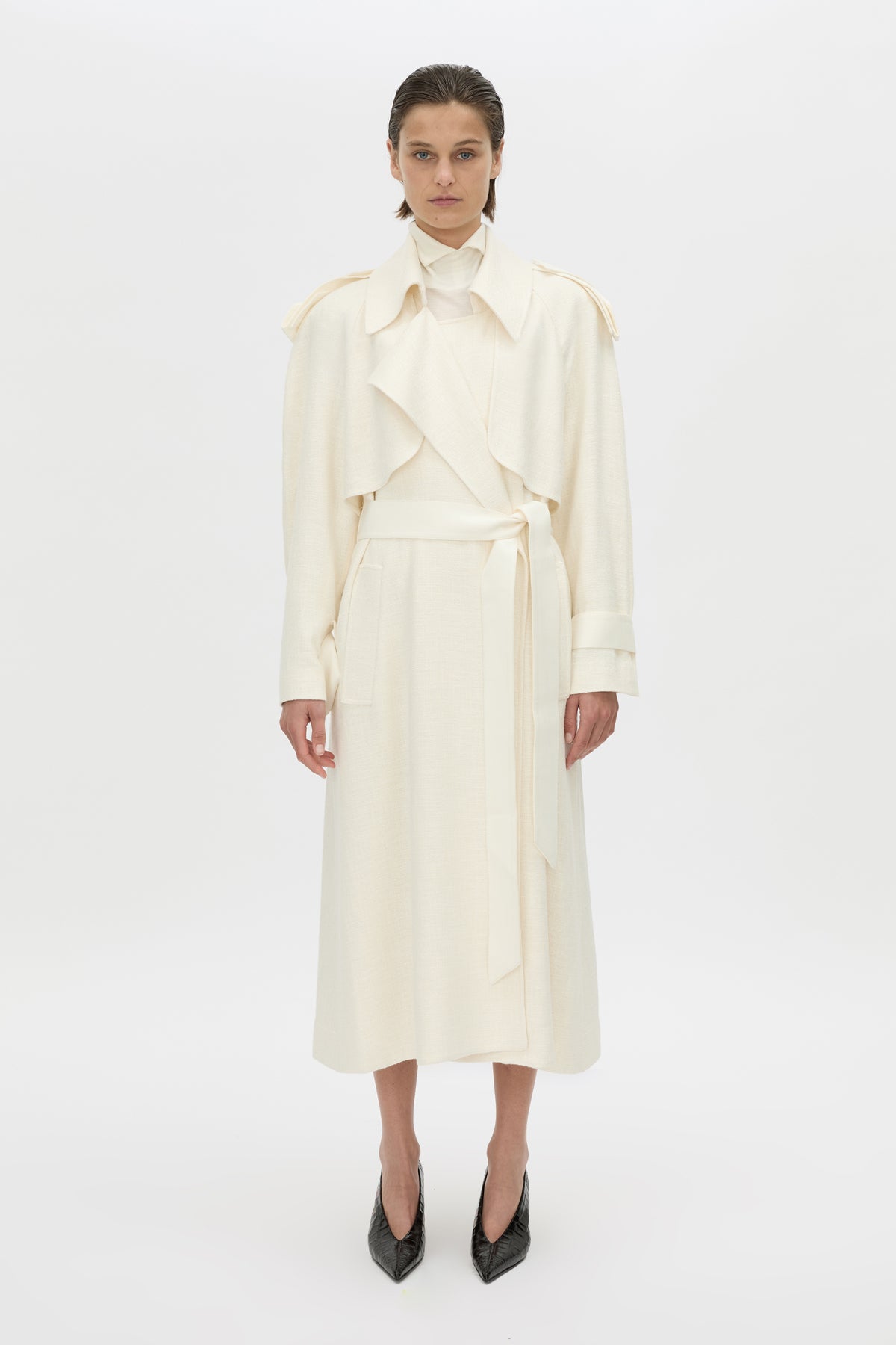 Front-styled-2 view CAMILLA AND MARC Ontario Trench Coat in cream with contrast knot epaulette detailing.