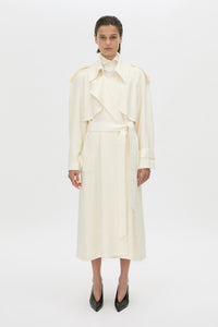 Front-styled-2 view CAMILLA AND MARC Ontario Trench Coat in cream with contrast knot epaulette detailing.