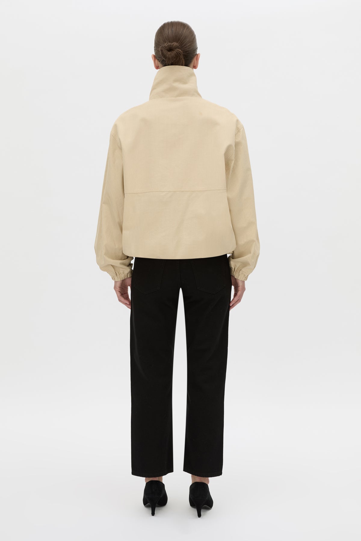 Back view CAMILLA AND MARC Oren Funnel Neck Jacket in ochre stripe with CAMILLA AND MARC monogram embroidery.
