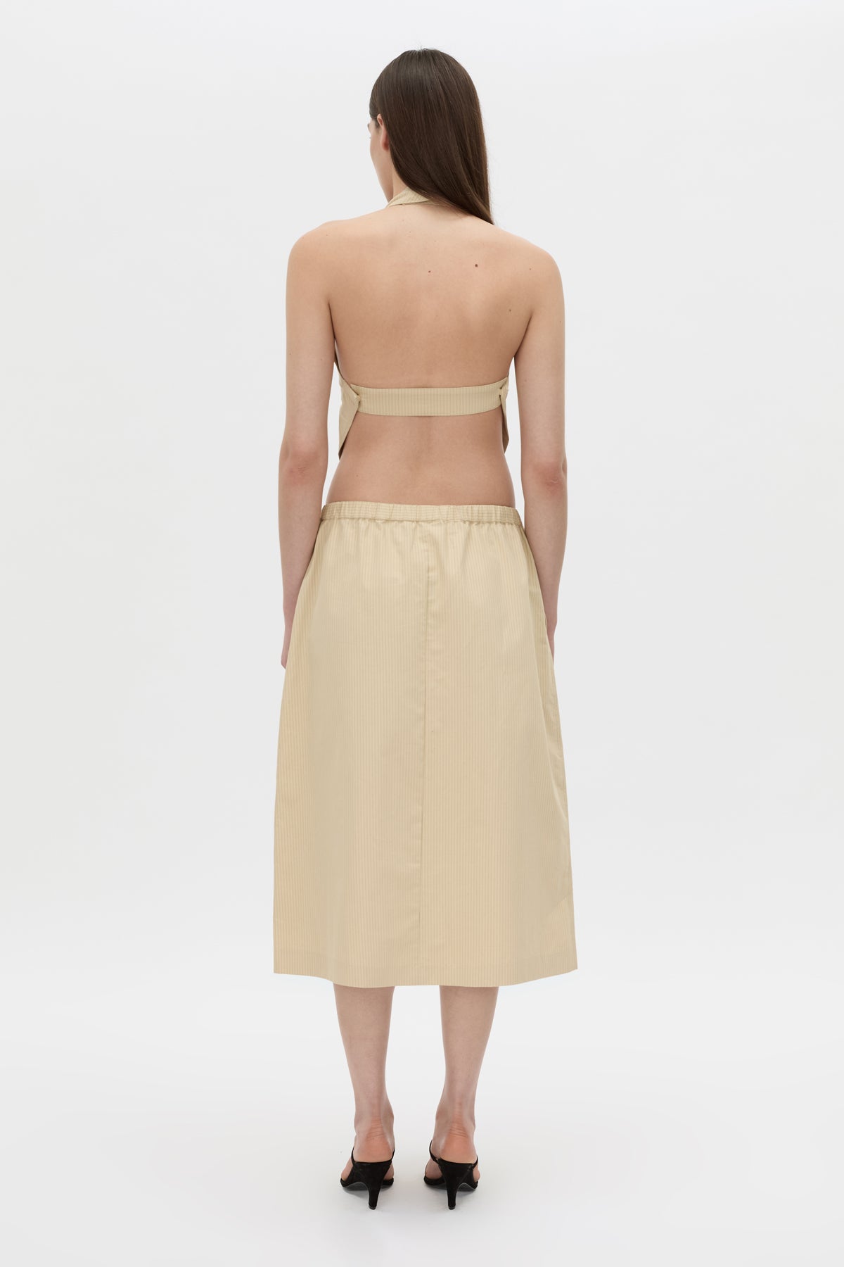 Back view CAMILLA AND MARC Oren Stripe Midi Skirt in ochre stripe with an adjustable mid‑rise waistline.