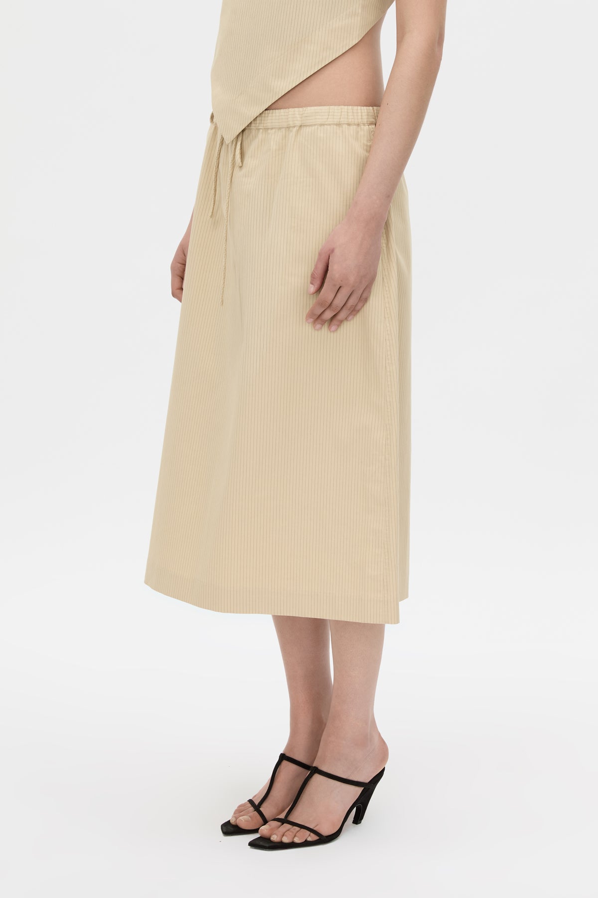 Cropped view CAMILLA AND MARC Oren Stripe Midi Skirt in ochre stripe with an adjustable mid‑rise waistline.