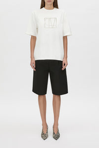 Patina Front Monogram Tee - CAMILLA AND MARC Patina white tee with gold plastisol monogram print at centre front, tubular rib at