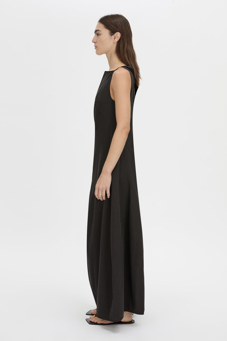 Side view CAMILLA AND MARC Paulena Maxi Dress in black with cocoon shaping and a straight neckline.