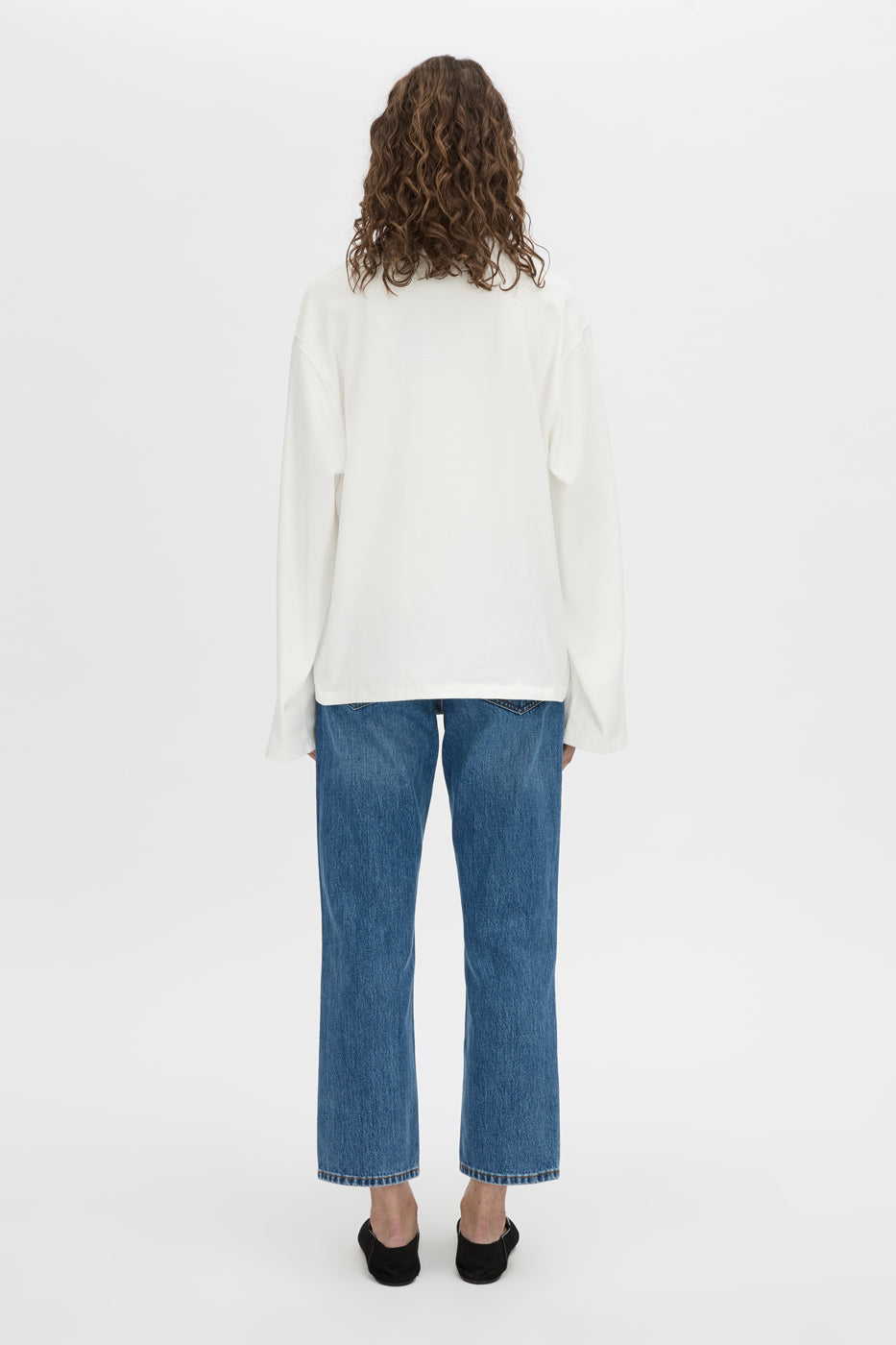 Back view CAMILLA AND MARC Peretti long sleeve tee in white with wide shaped sleeves.