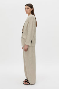 Side view CAMILLA AND MARC Phostre Linen Relaxed Blazer in sand soft tailoring fabrication.