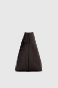 Side ghost view CAMILLA AND MARC Poppy Eel Clutch in Burgundy eel‑embossed leather with ribbed gold hardware.