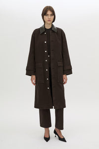 Styled view CAMILLA AND MARC Raha crew neck rib bodysuit in espresso brown with cap sleeve and ribbed neckline.
