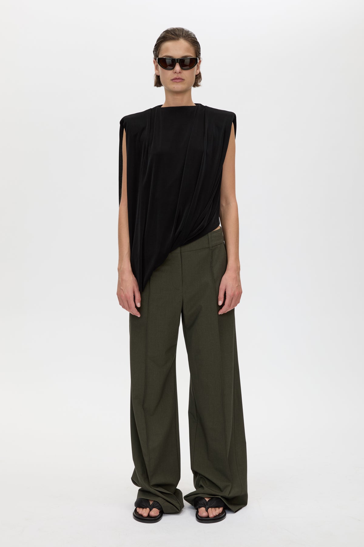Front styled view CAMILLA AND MARC Ravine Draped Top in Black with asymmetric silhouette.