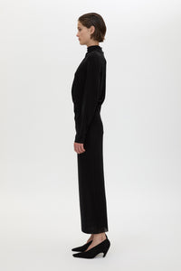 Side view CAMILLA AND MARC Ravine Midi Dress in Black with asymmetric draped neckline.