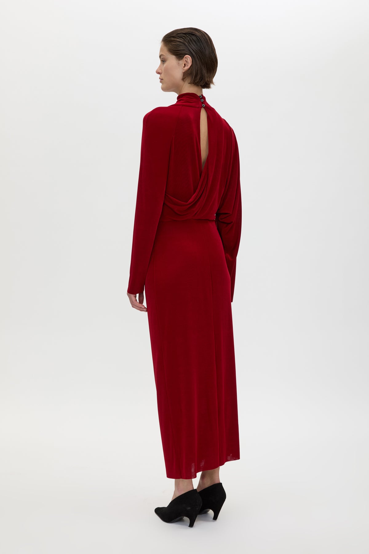 Back view CAMILLA AND MARC Ravine Midi Dress in Cherry Red with asymmetric draped neckline.