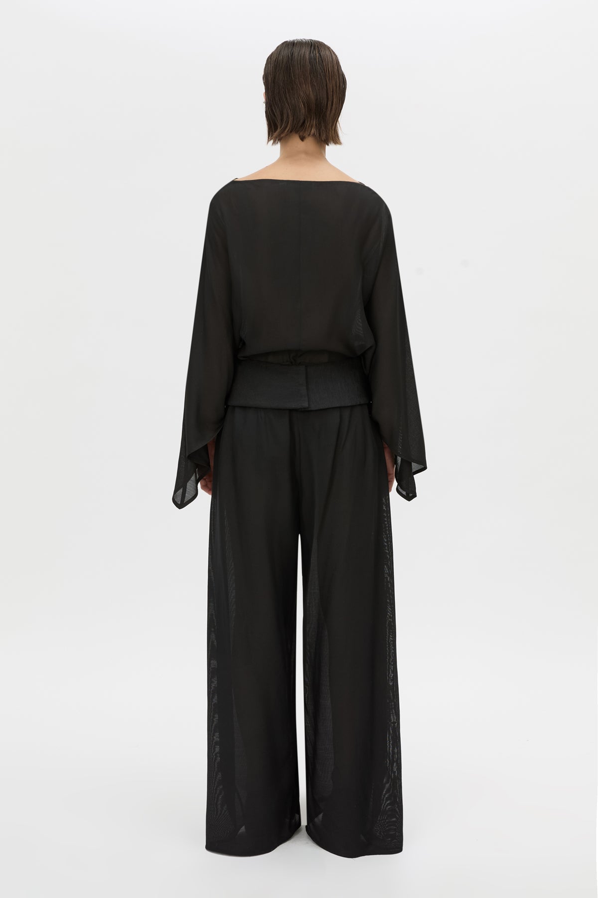Back view CAMILLA AND MARC Rene Wide-Leg Pant in black with a removable folded belt and georgette shorts.