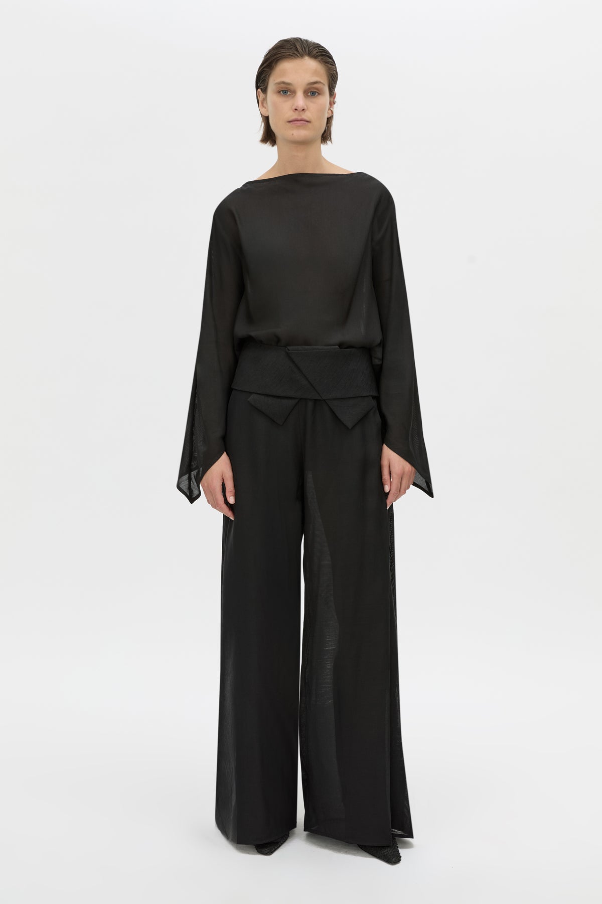 Front-styled-2 view CAMILLA AND MARC long-sleeve Rene Draped Top in black with a boat neckline.